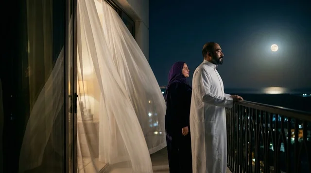 Saudi Couple on Balcony under Full Moon at Night