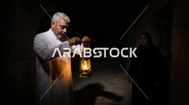 Arab Man with Lantern in Dark Traditional Room