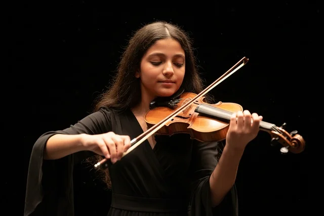 Saudi Girl Playing Violin on Black Background