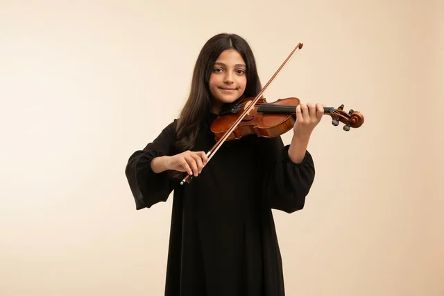 Young Saudi Girl Playing Violin in Studio