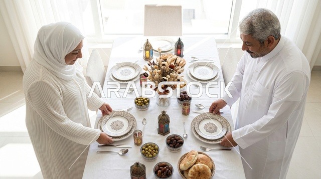 Arab Couple Setting Dining Table for Ramadan Iftar