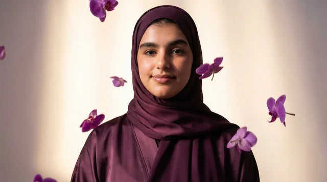 A Saudi woman in a hijab with glowing light trails.