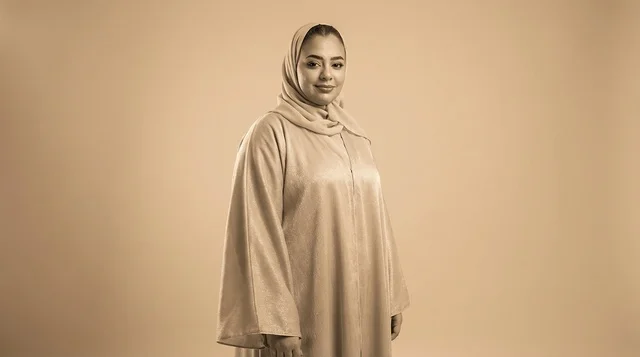 Emirati Woman in Traditional Beige Abaya and Hijab