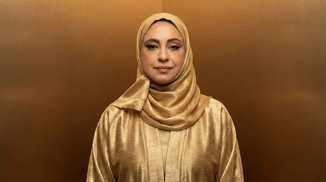 Arab Woman in Gold Hijab and Abaya Studio Portrait
