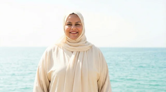 Emirati Woman in Abaya Standing by the Sea
