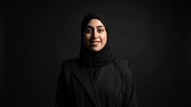 Emirati Woman in Black Hijab on Dark Background