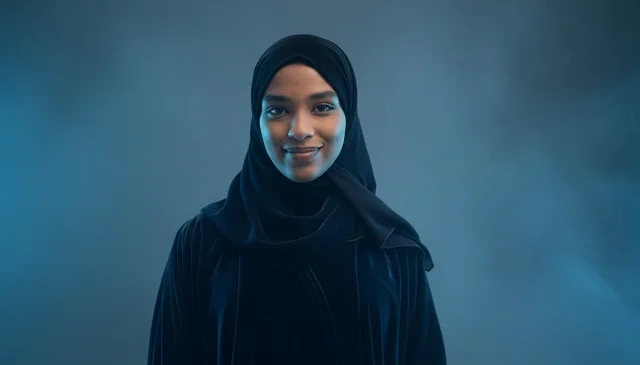 Saudi Woman in Black Abaya with Blue Studio Lighting