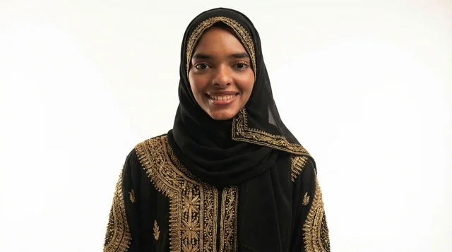 Smiling Woman in Traditional Black and Gold Abaya