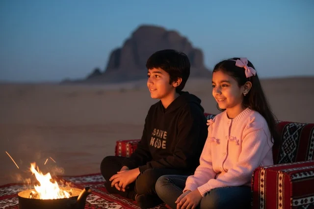 Arab Children Sitting by Desert Campfire at Night