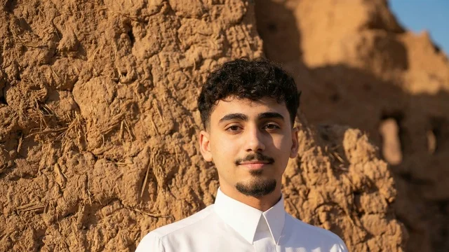 Saudi Man in White Thobe at Heritage Site