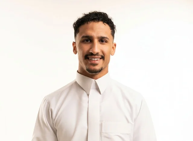 Smiling Saudi Man in White Thobe on White Background