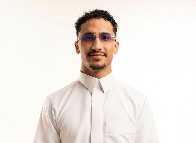 Saudi Young Man in White Thobe with Tinted Glasses
