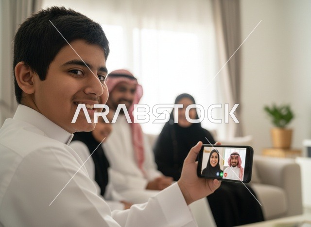 Saudi Boy Using Smartphone for Family Video Call
