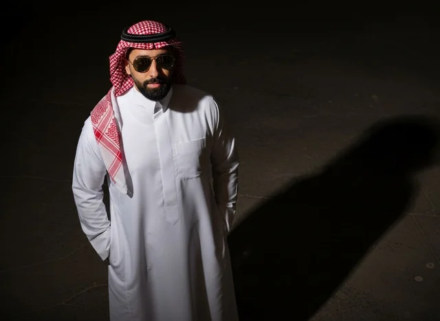 Saudi Man in Traditional Thobe and Shemagh at Night