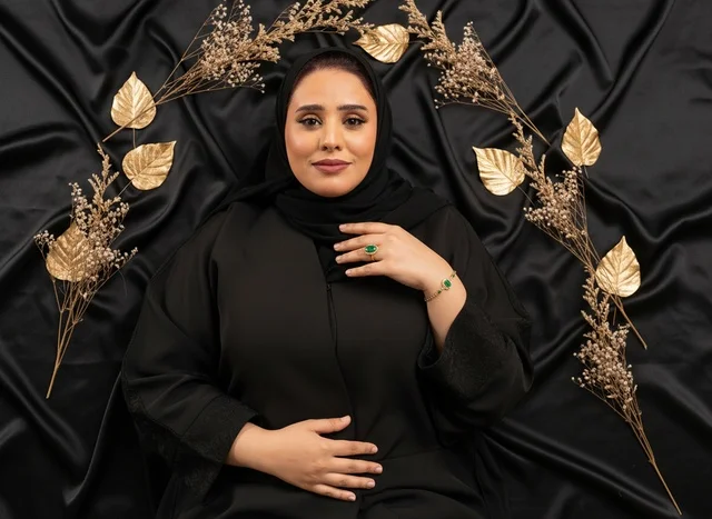 Saudi Woman in Black Abaya with Gold Leaves