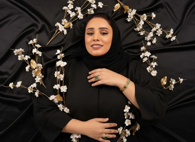 Saudi Woman in Abaya on Black Silk Background