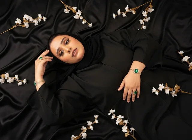 Saudi Woman in Black Abaya with Emerald Jewelry
