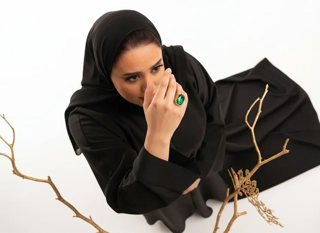 Arab Woman in Abaya with Green Ring Studio