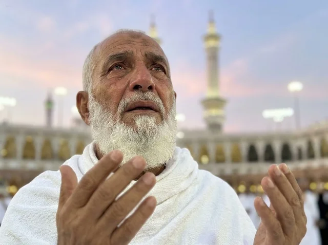 Elderly Pilgrim Praying at Makkah Mosque during Sunset Elderly Pilgrim Praying at Makkah Mosque during Sunset