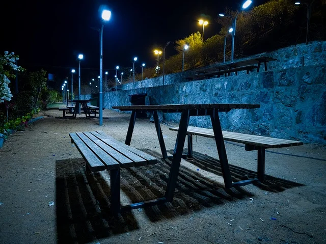 Wooden Picnic Table and Benches in Sharjah Park at Night
