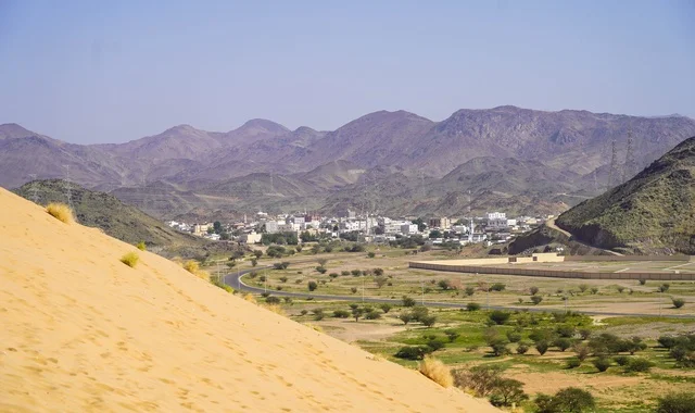 Sand Dune and Green Valley with Mountains in Saudi Arabia