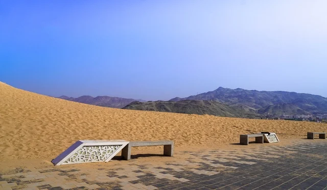 Desert Walkway with Modern Benches and Mountains View
