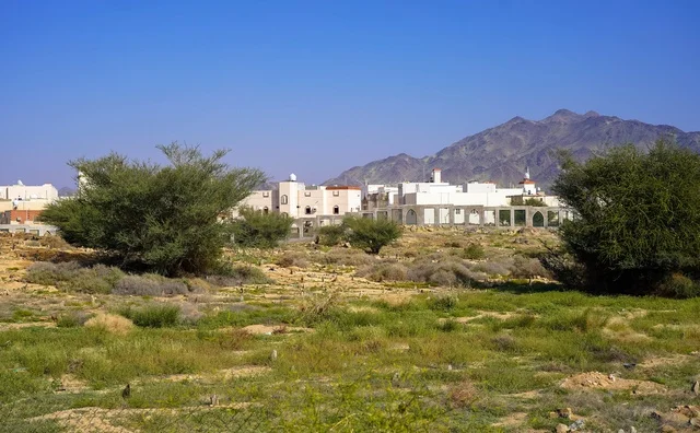 Rural Village near Mountain Range in Daylight