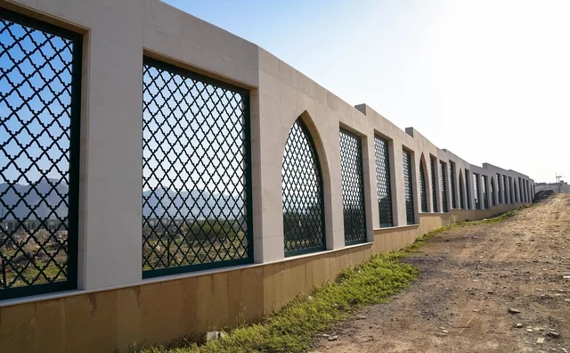 Modern Concrete Wall with Iron Grills on Hillside