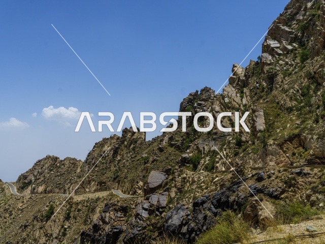Rocky Mountain Range with Winding Road Scenic Landscape
