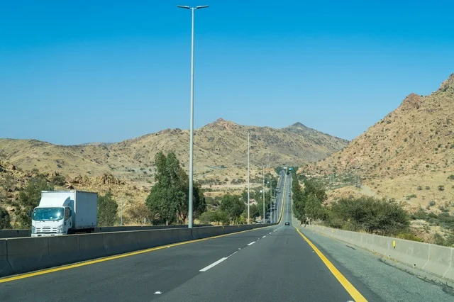 Asphalt Highway Road Through Mountain Desert Landscape