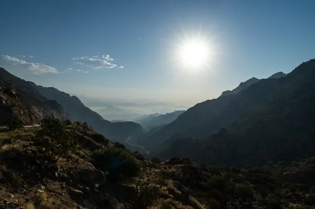 Rugged Mountain Valley Under Bright Sunny Sky Landscape