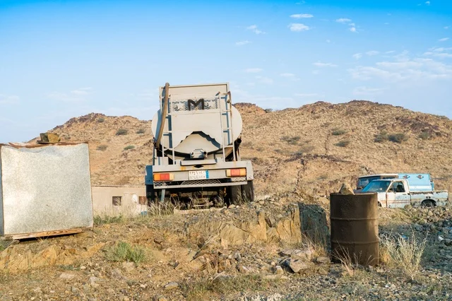 Heavy Construction Truck in Rocky Desert Landscape