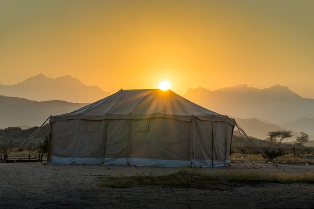 Traditional Desert Tent at Sunset with Mountain View
