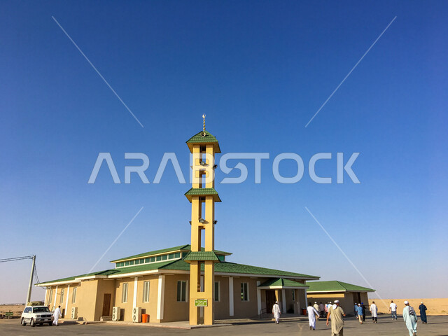 A picture of a mosque in the Kingdom of Saudi Arabia, worship and getting closer to God, religious landmarks in Saudi Arabia, Muslims performing prayer in the mosque, the minaret of the mosque, the sound of the call to prayer, the call to Muslims to pray