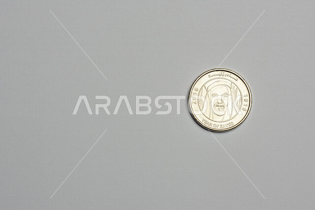 Image of UAE dirham coin, UAE dirham denomination of 1 dirham, image of Sheikh Zayed printed on dirham coin, coins, finance and economy, white background