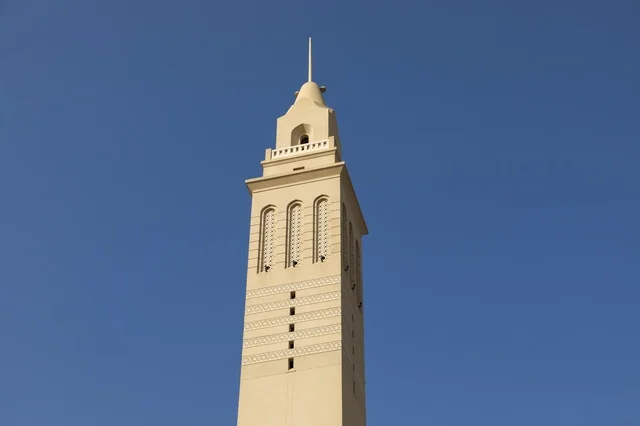 Islamic Mosque Minaret in Nizwa Oman under Blue Sky