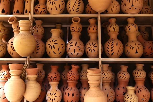 Traditional Clay Pottery on Shelves in Muscat Oman