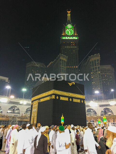 A picture of the Kaaba at night inside the Great Mosque of Mecca, the obligation of Hajj, the performance of Umrah, the circumambulation of the Kaaba, Islamic landmarks in the Kingdom of Saudi Arabia, Islamism and worship.