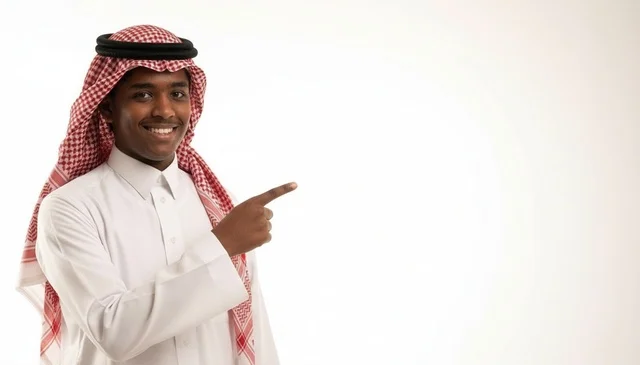 Saudi Man Pointing To Copy Space On White Background