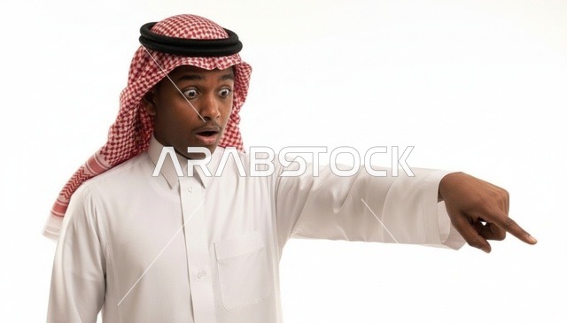 Surprised Saudi Arab Man Pointing on White Background