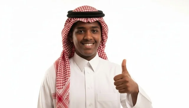 Smiling Saudi Man in Traditional Thobe Giving Thumbs Up