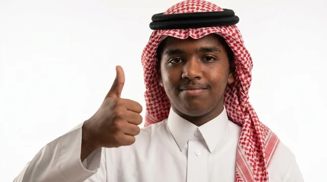 Saudi Man in Traditional Attire Giving Thumbs Up Sign