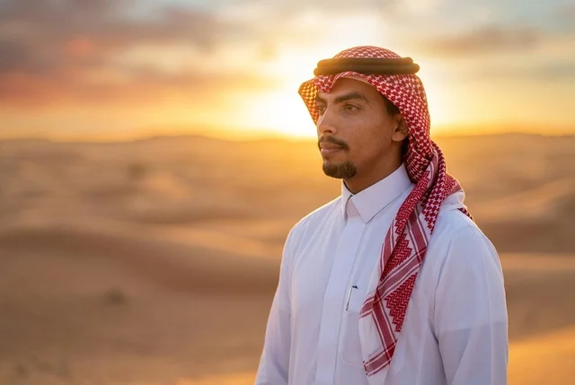 Saudi Arabian Man in Desert Dunes at Sunset Portrait
