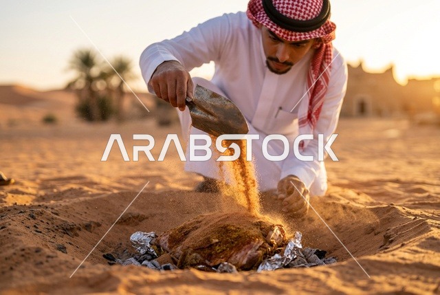 رجل سعودي يطبخ اللحم تحت الأرض في الصحراء