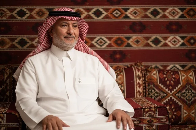 Senior Saudi Man in Traditional Thobe Sitting in Majlis