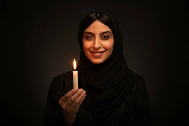 Arab Woman in Hijab Holding Burning Candle