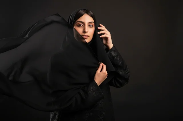 Saudi Woman in Black Abaya with Flowing Sheila Hijab