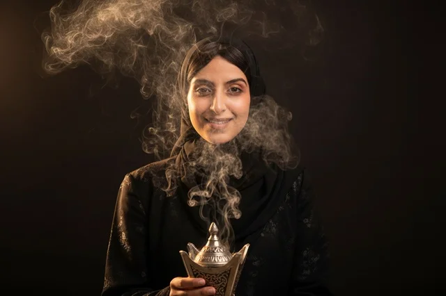 Saudi Woman Holding Traditional Arabian Incense Burner