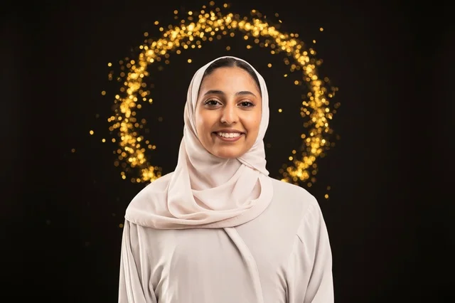 Smiling Arab Woman in Hijab with Golden Bokeh Portrait