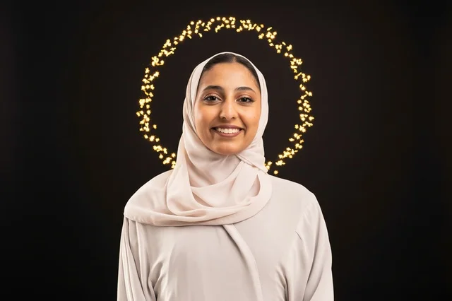 Smiling Arab Woman in Hijab with Bokeh Halo Lights